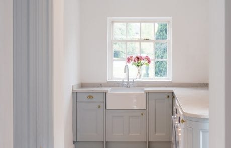 Interior kitchen view with flowers overlooking window