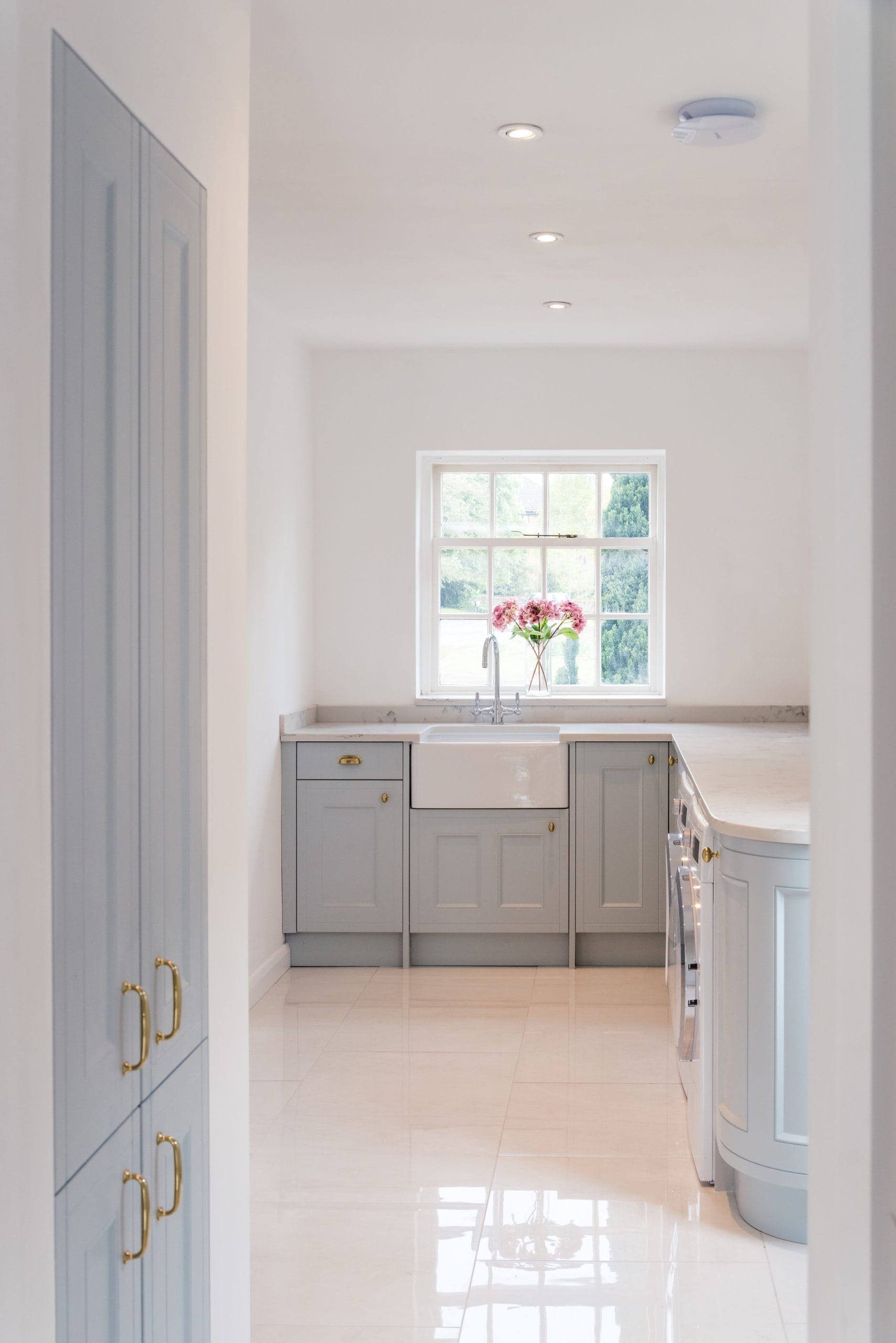 Interior kitchen view with flowers overlooking window